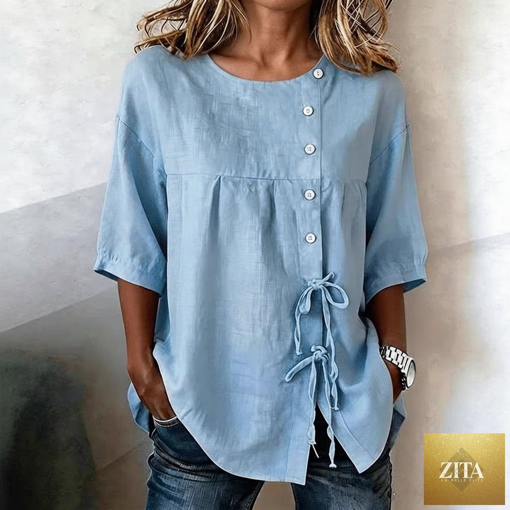 Women's lace-up button shirt from MERIDGE, featuring a stylish design with buttons and lace-up details, worn as a fashionable top.
