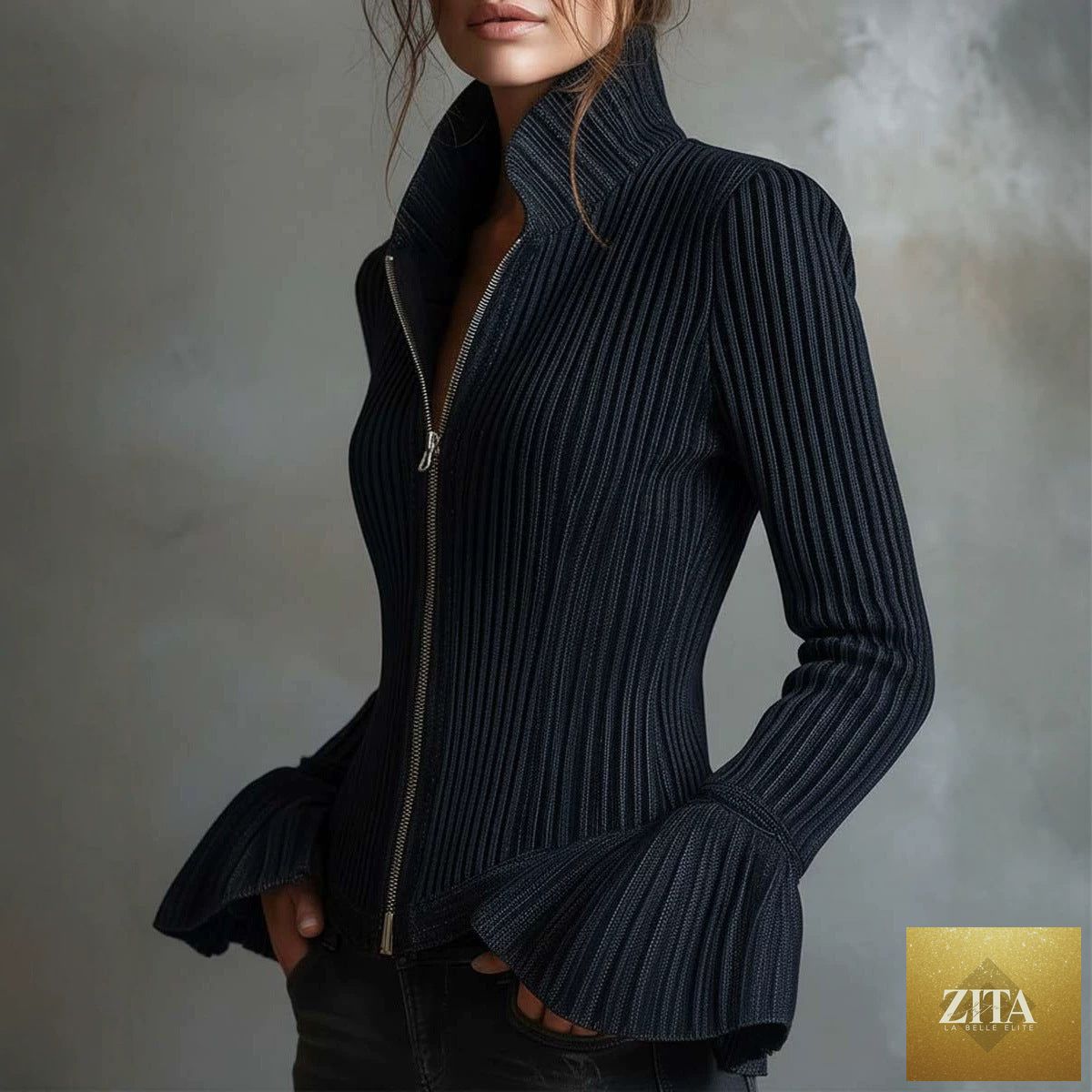 Women's slim-fit rib-knit zip-up top with flared cuffs by FitiqueFit, shown hanging with a close-up of the textured fabric.