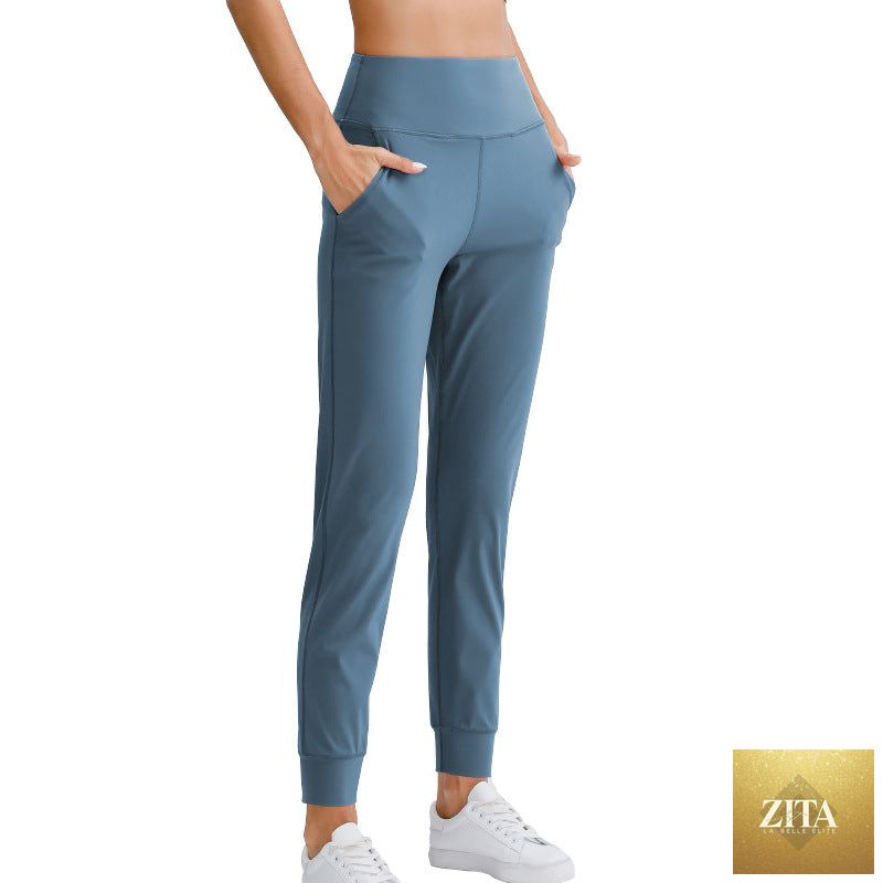 Women’s solid color elastic jogger pants by Sell My Stuff, loose fit with pockets, perfect for yoga, running, or casual workouts.