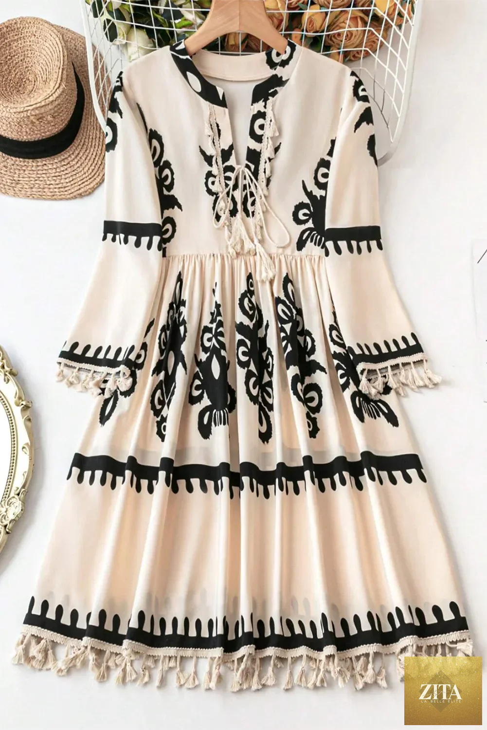 Tassel printed three-quarter sleeve mini dress from Shopiebay, featuring a stylish pattern and flowy silhouette.