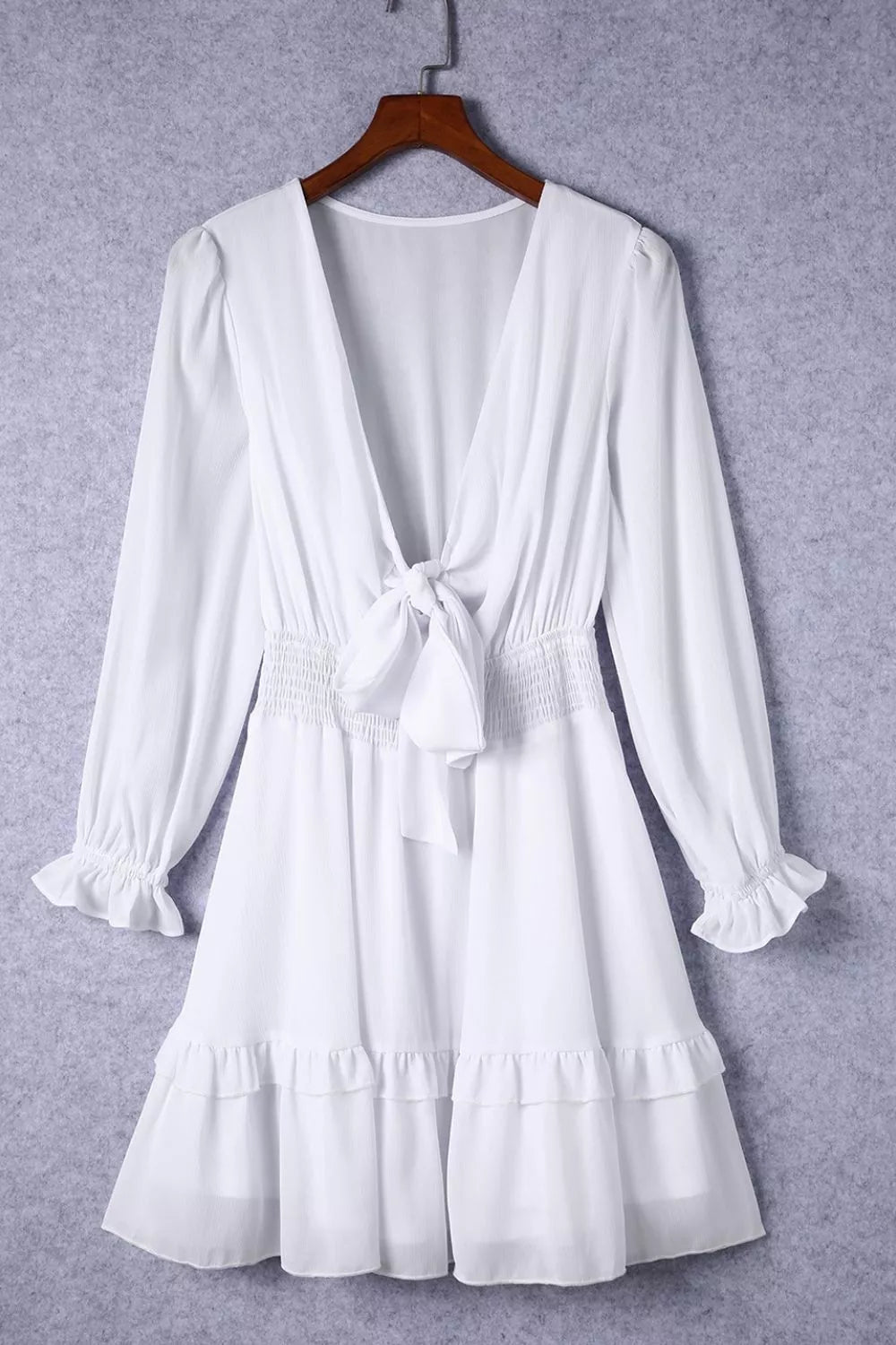 Elegant Shopiebay tie-front ruffle mini dress with smocked waist, featuring a stylish and feminine design.