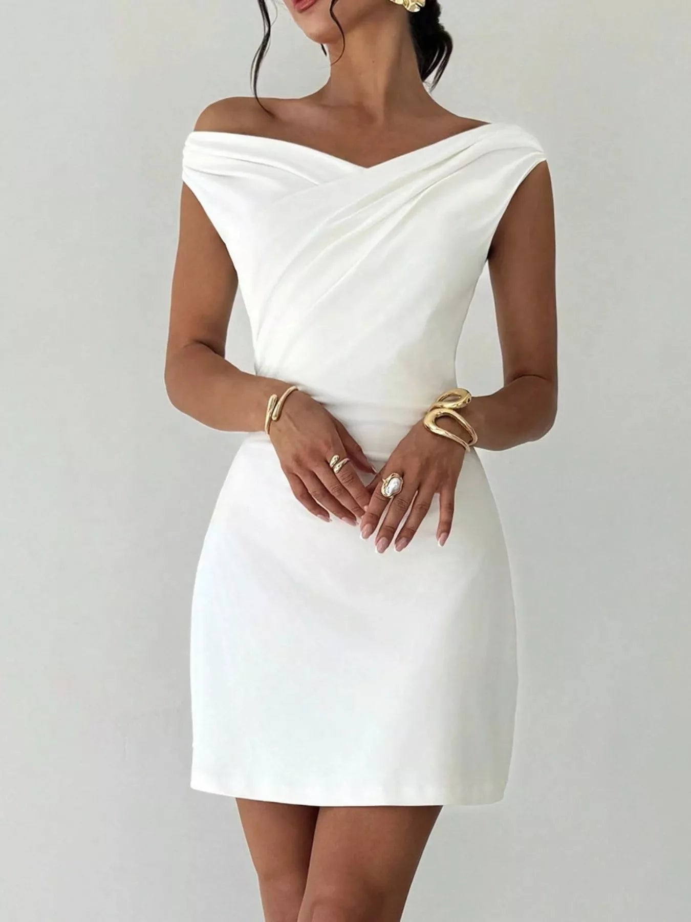 Elegant off-shoulder draped mini dress from Shopiebay featuring a stylish silhouette and flowing fabric for a chic look.