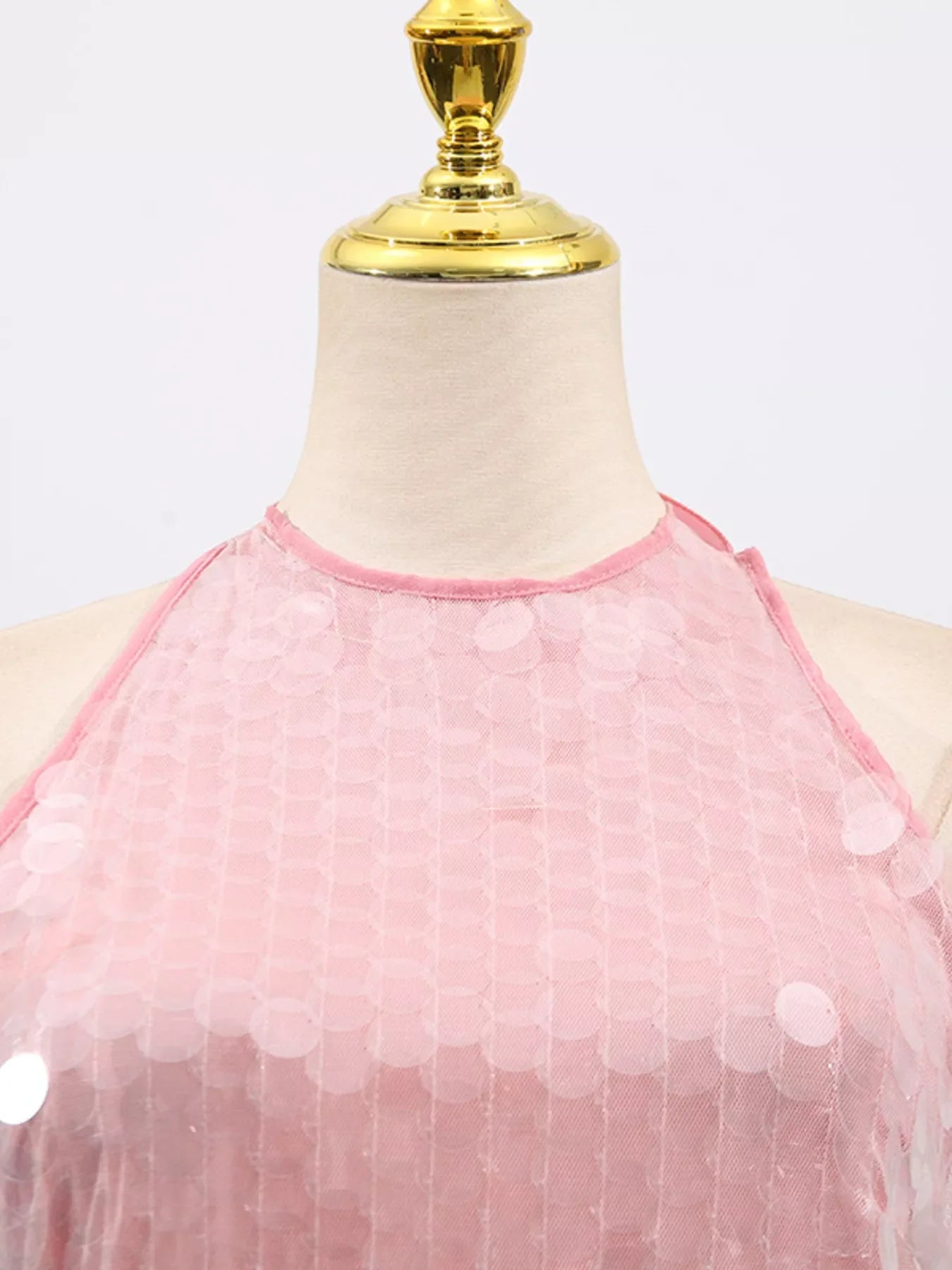 Sequin halter neck mini dress by Shopiebay featuring sparkling sequins and a stylish halter neckline for a glamorous look.