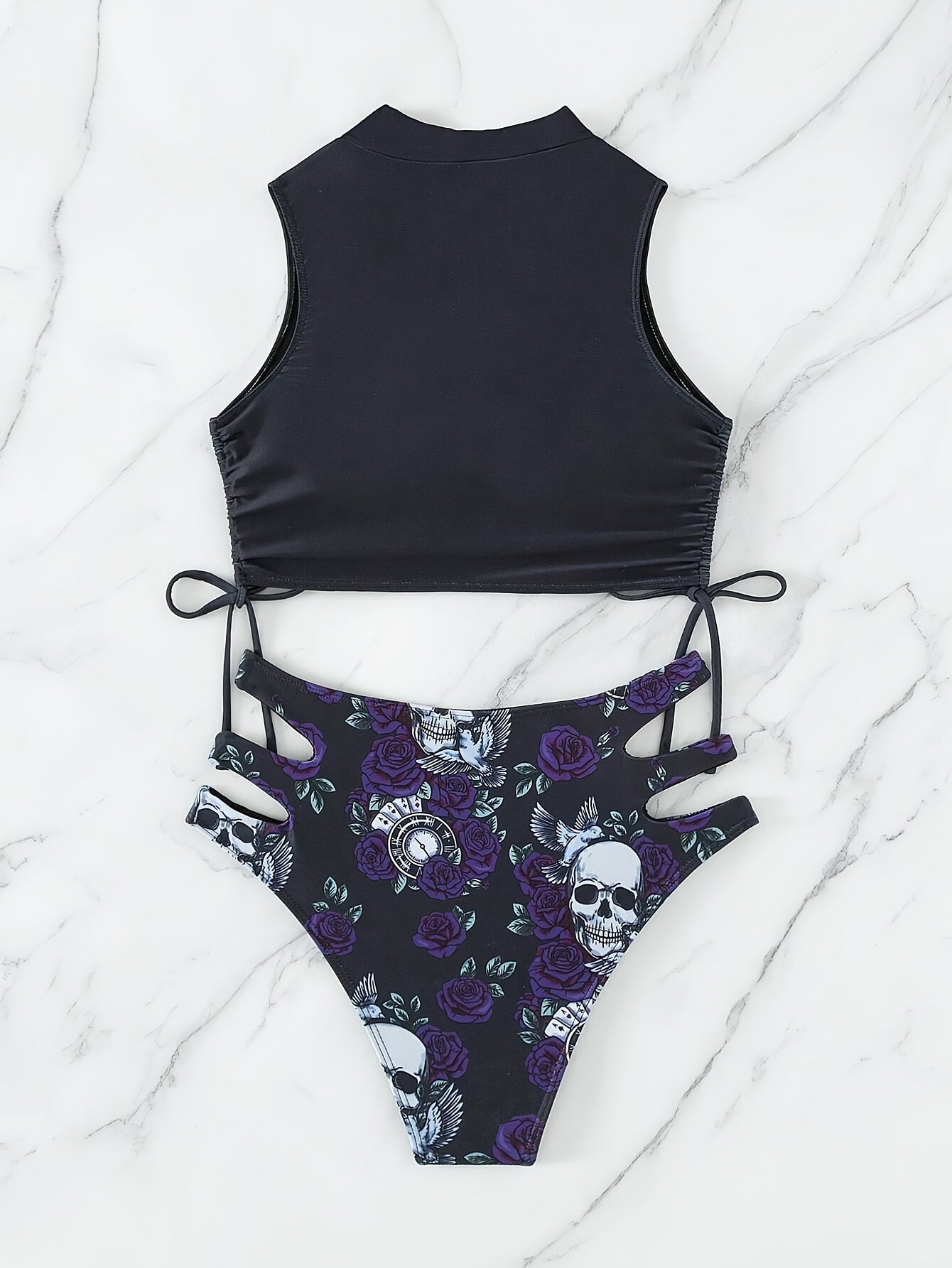 Stevvex bikini set with skull print, floral lace-up design, hollow-out style, and crew neck, perfect for beach and summer festivals.