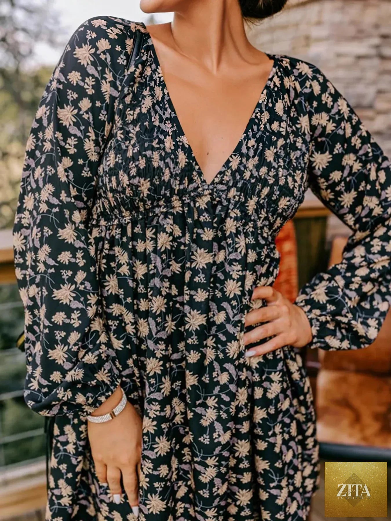 Floral deep V neck smocked bust bubble sleeve babydoll dress by Shopiebay, featuring a flowy silhouette and vibrant floral pattern.