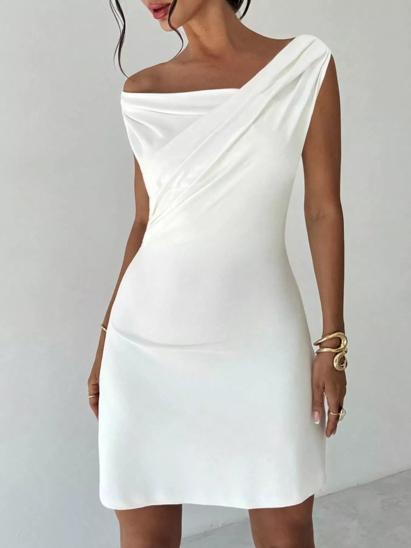 Elegant off-shoulder draped mini dress by Shopiebay featuring a stylish silhouette and flowing fabric for a chic look.
