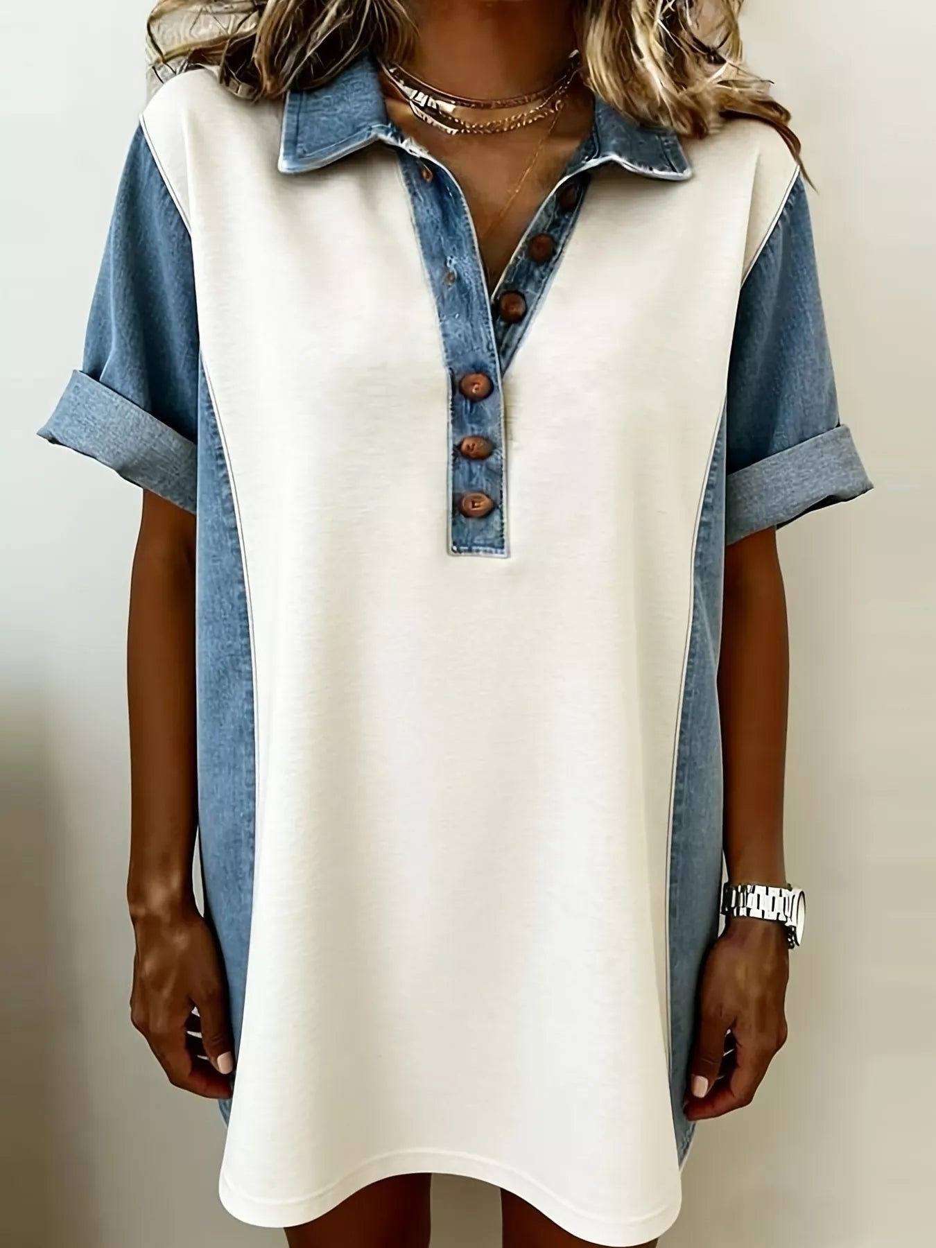 Denim patchwork button-front mini dress by Shopiebay with long sleeves and a fitted silhouette, displayed on a model.