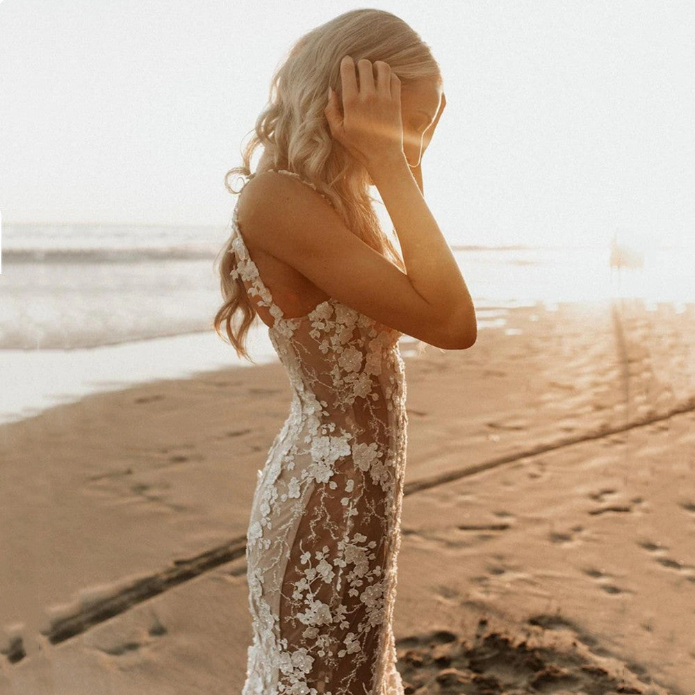 Elegant mermaid wedding dress by FLIPSTYLEZLLC with intricate 3D lace appliques and a fitted silhouette, showcased on a model.