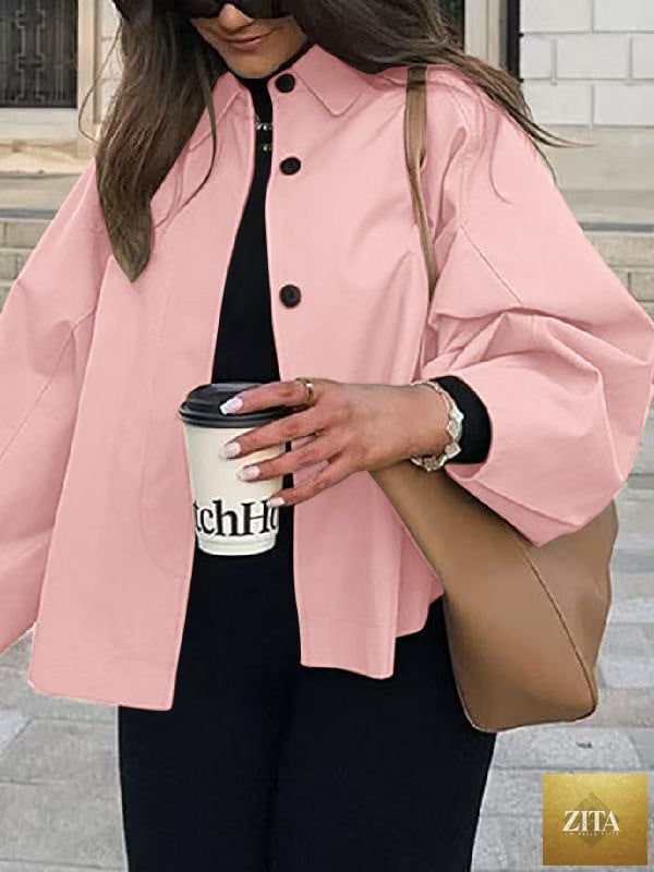 Women's French-style loose mid-length trench coat by FitiqueFit, showing its classic collar, belted waist, and lightweight fabric.