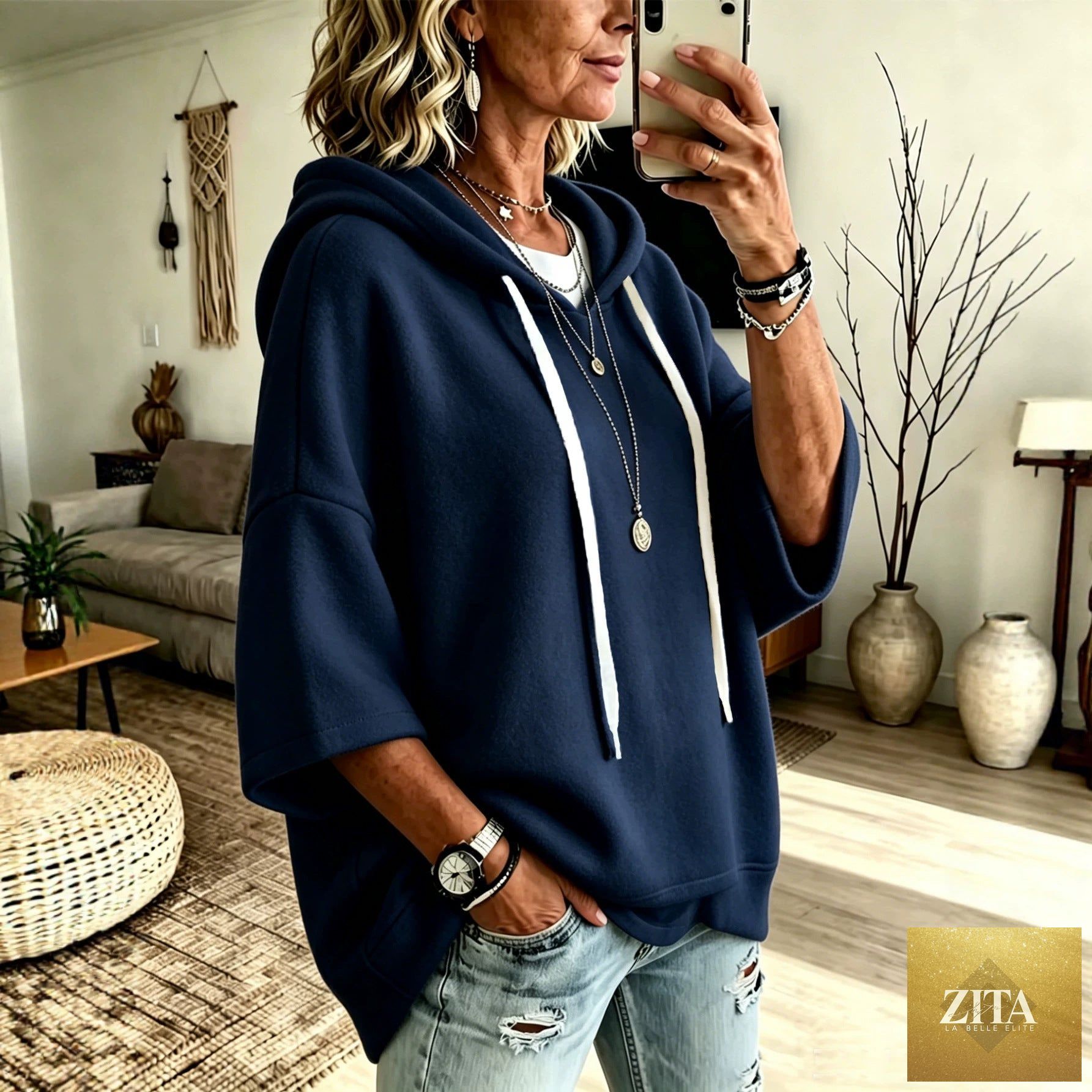 Women’s oversized batwing sleeve hoodie by FitiqueFit, loose fleece pullover with a relaxed fit and cozy design.
