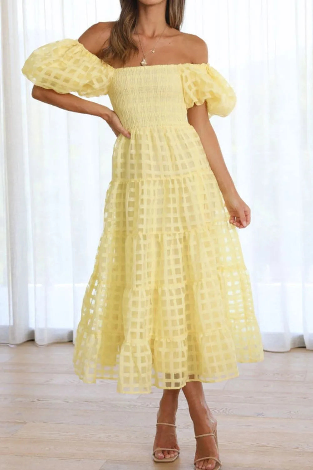 Off shoulder short puff sleeve midi dress by Shopiebay with a flowing silhouette and stylish design, perfect for casual or semi-formal occasions.