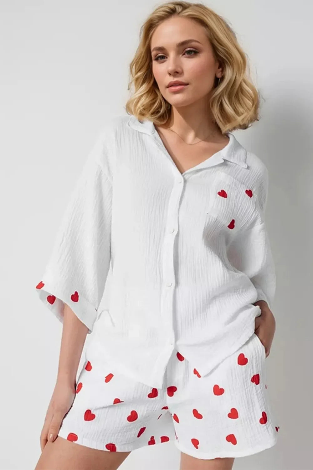 Basic Bae heart-collared neck button-down top and shorts set, casual and stylish for warm weather, featuring a playful heart detail.