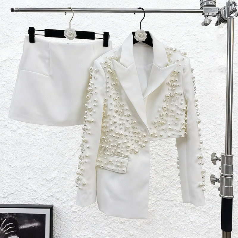 Women’s beaded blazer and skirt set by The Fashion Celestial featuring a deep V-neck, heavy detailing, stylish outfit for women.