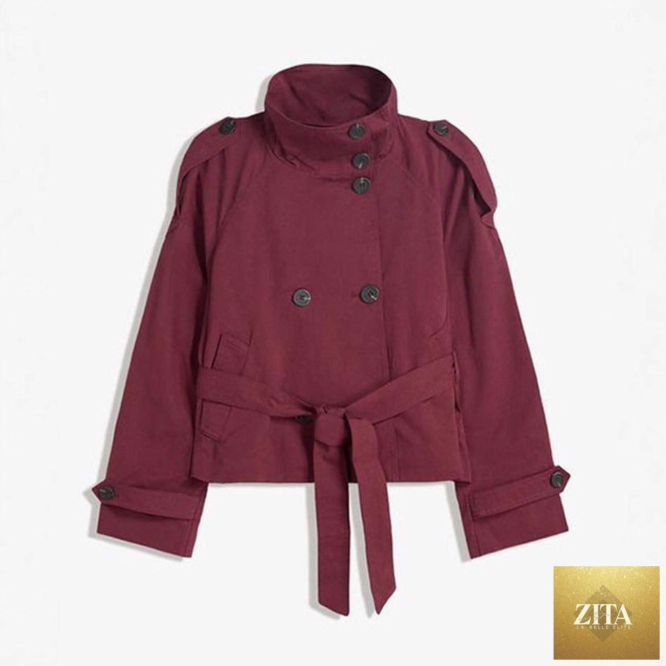 Women’s lace-up waist trench coat from FitiqueFit featuring a tailored design, lapel collar, and long sleeves, displayed on a hanger.
