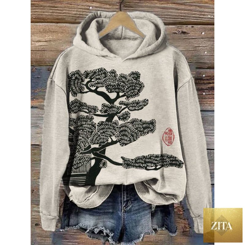 Women’s printed hooded long sleeve sweatshirt by FitiqueFit featuring a colorful floral pattern and a comfortable hood.