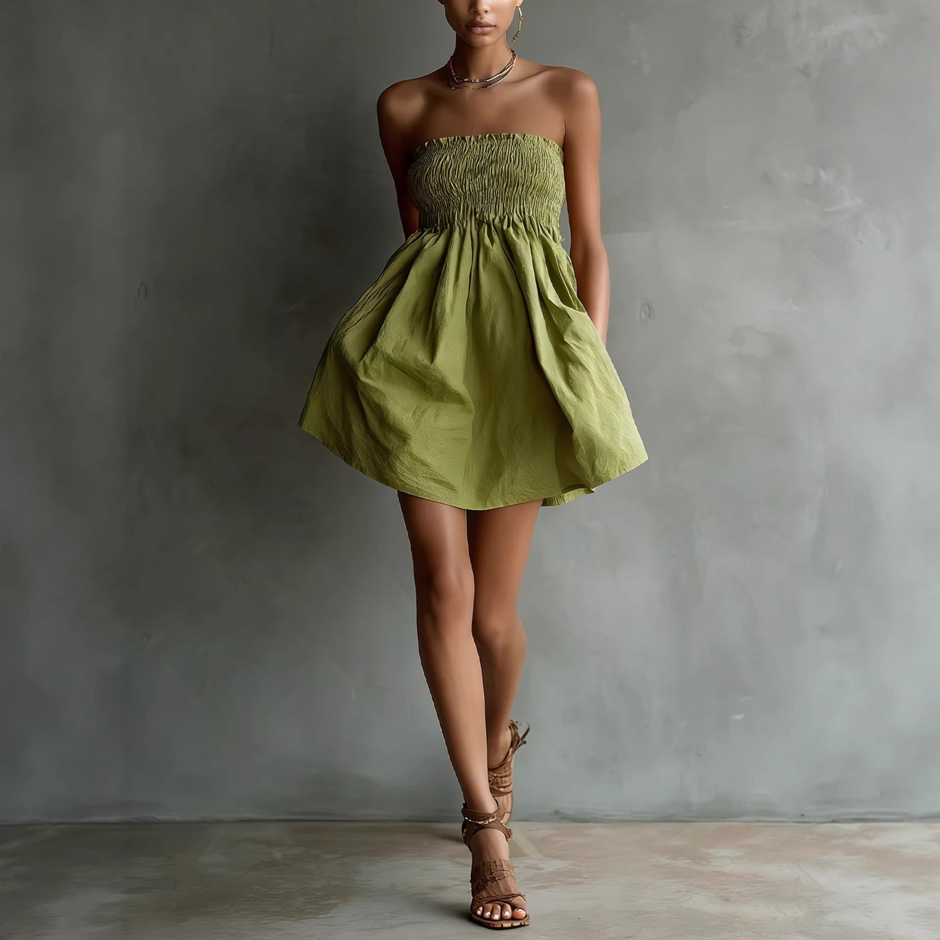 Women's strapless tube mini dress by FitiqueFit in solid color with elastic waist, casualwear style, displayed on a hanger.