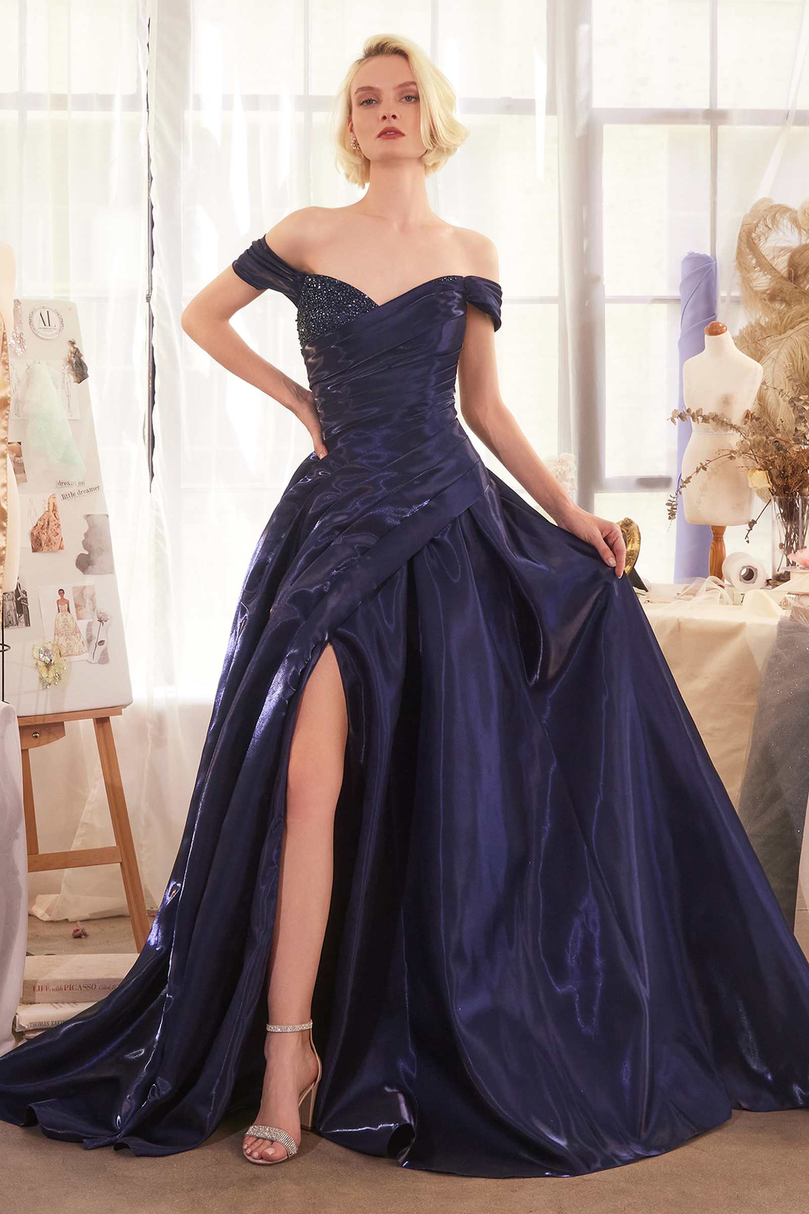 Navy Andrea & Leo A1424 off-the-shoulder organza ball gown dress with full skirt and elegant design.