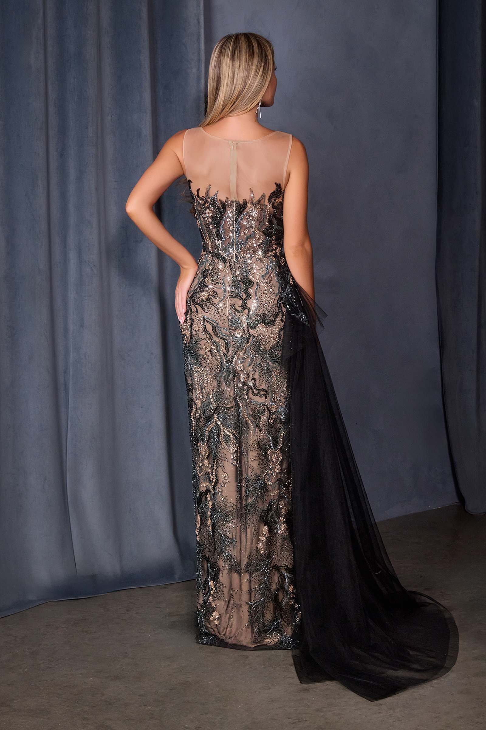 Black Andrea & Leo A1489 fitted formal gown with sequin embroidery over nude mesh, shown from the back.
