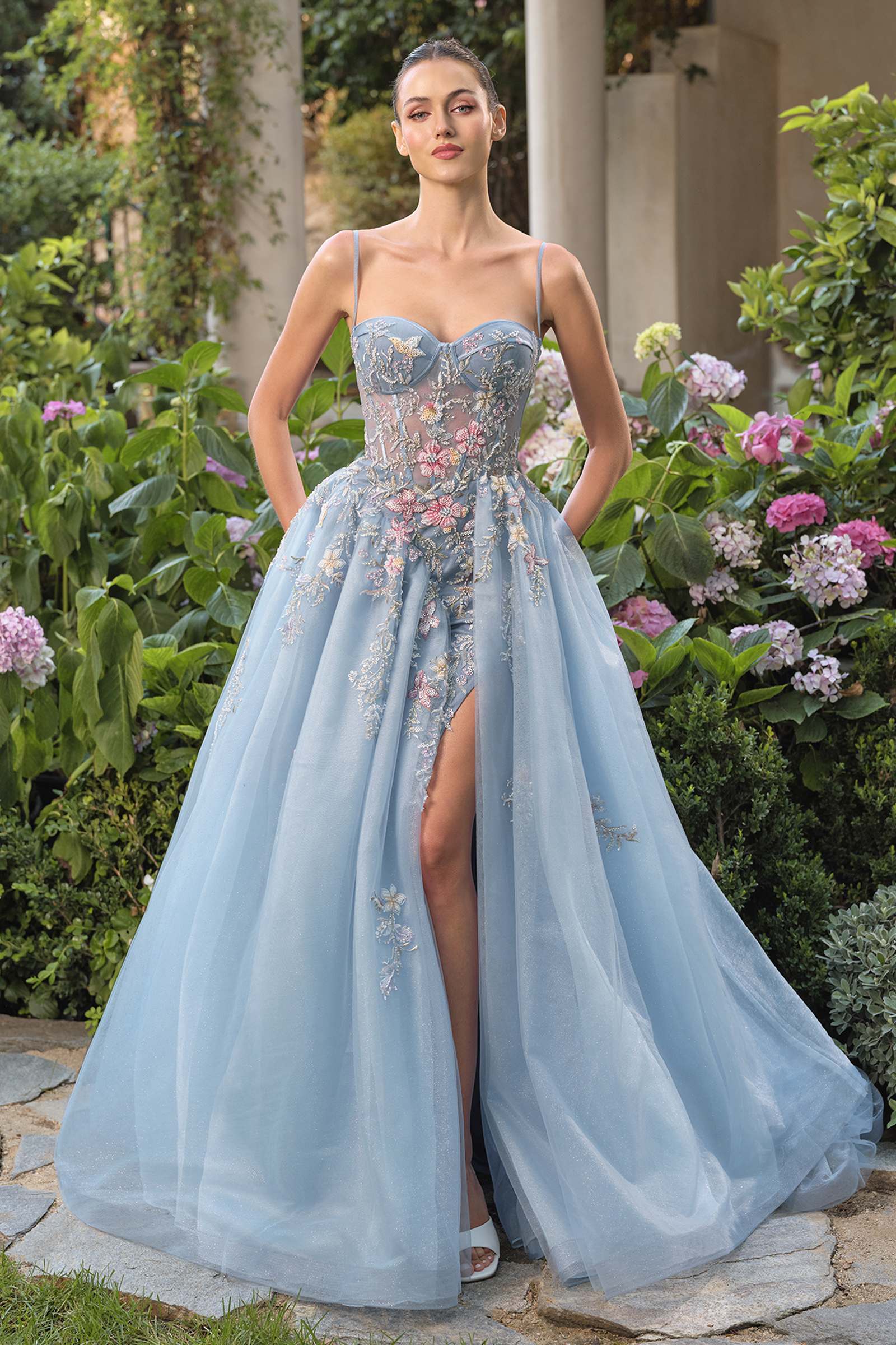 Blue Andrea & Leo A1490 strapless prom ball gown with whimsical design, showcased from the front view.