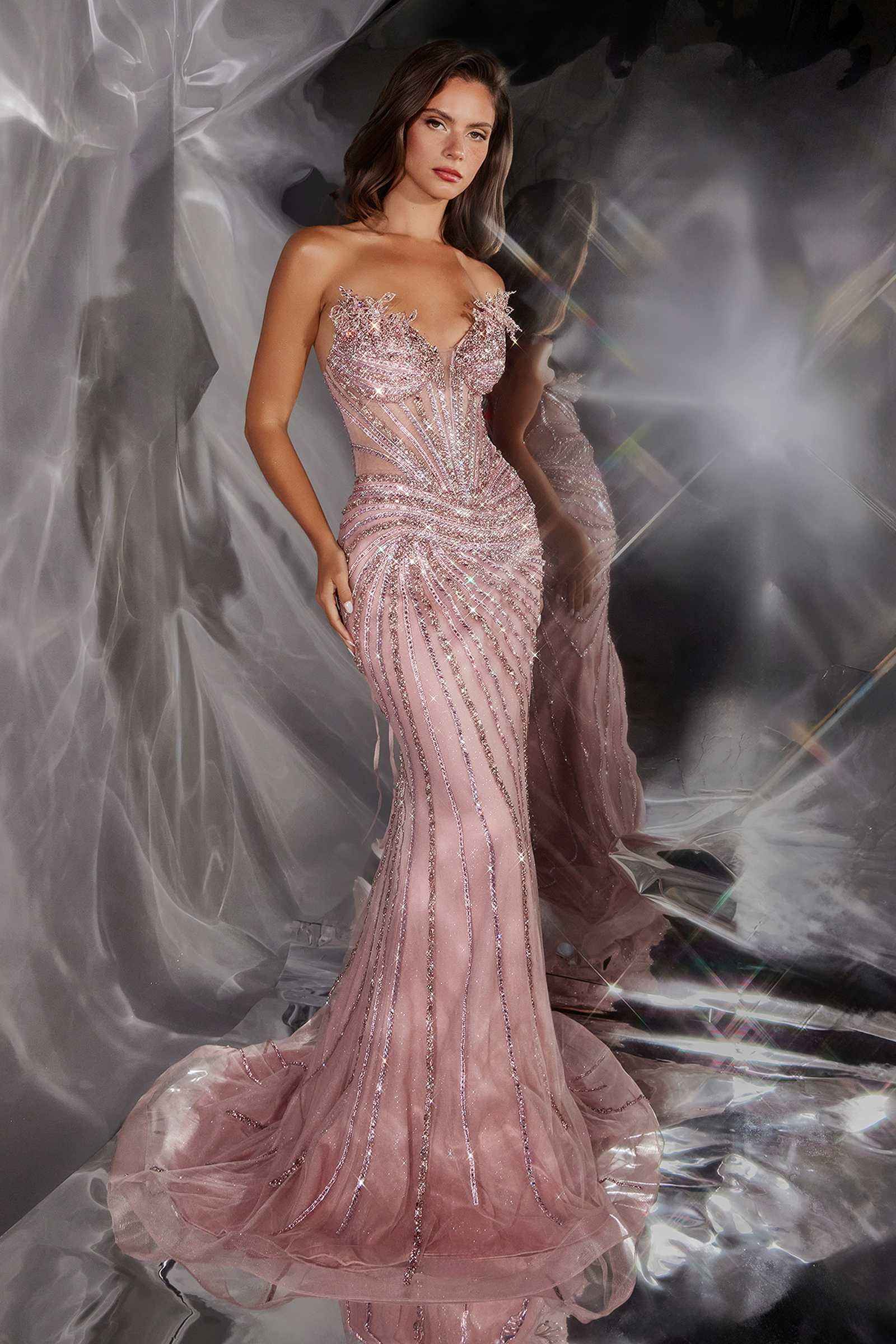 Radiant Ladivine CD715 strapless mermaid gown with linear beaded details in rose color, shown on a model.