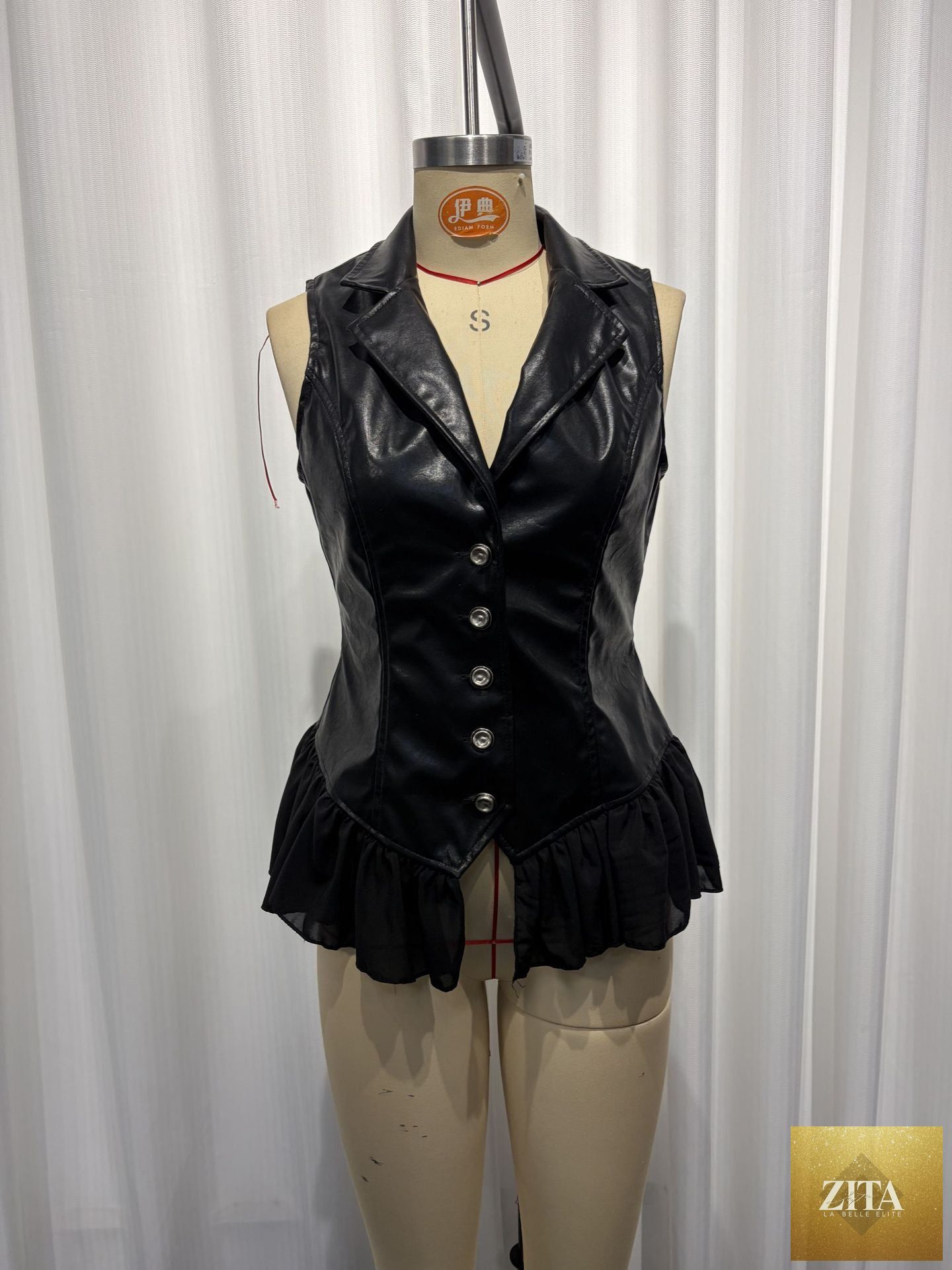 Black PU leather vest with deep V neckline, ruffle hem, fitted waist, gothic style, from FitiqueFit tops collection.