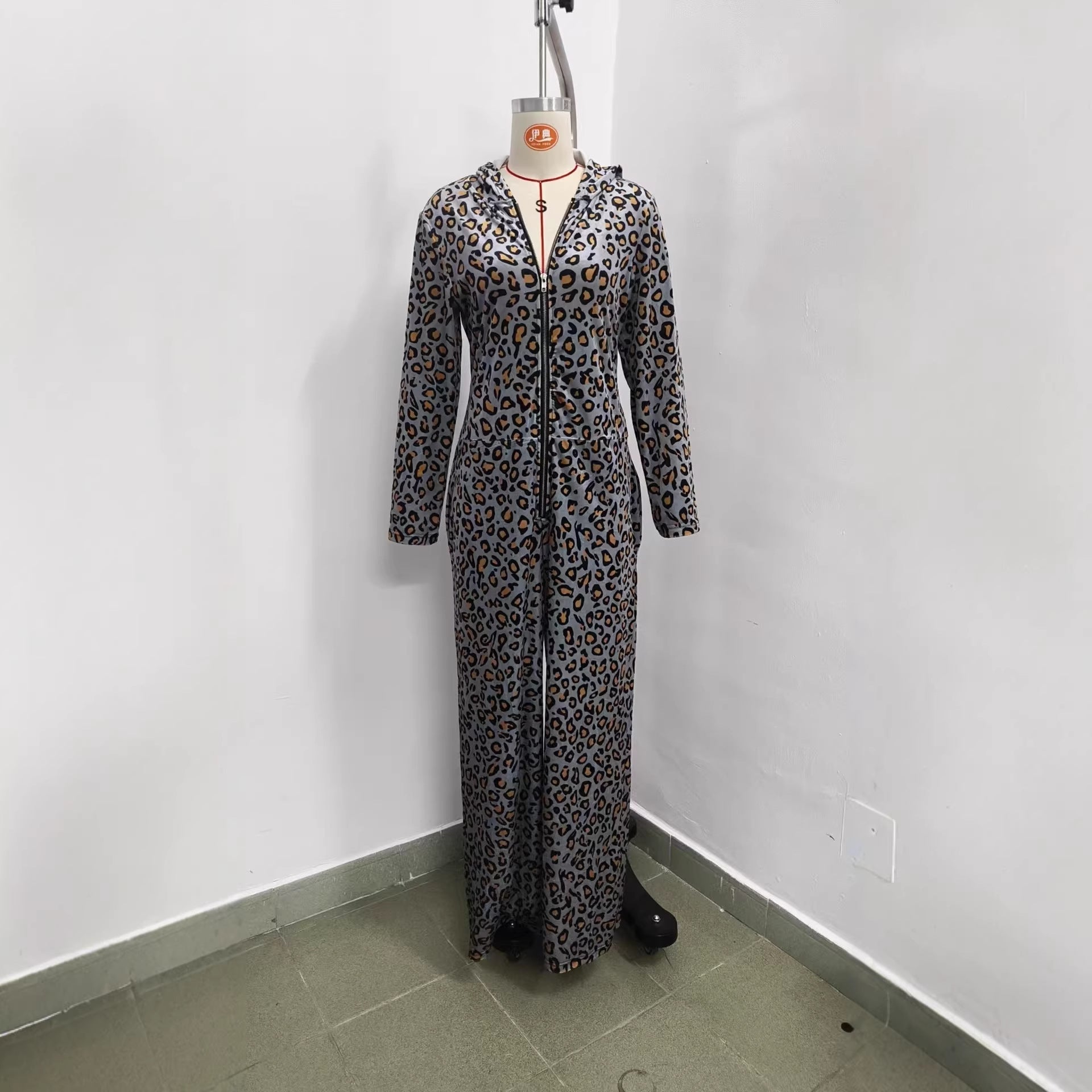 Leopard print petal sleeve hooded wide-leg jumpsuit by FitiqueFit, featuring a relaxed fit and stylish design.