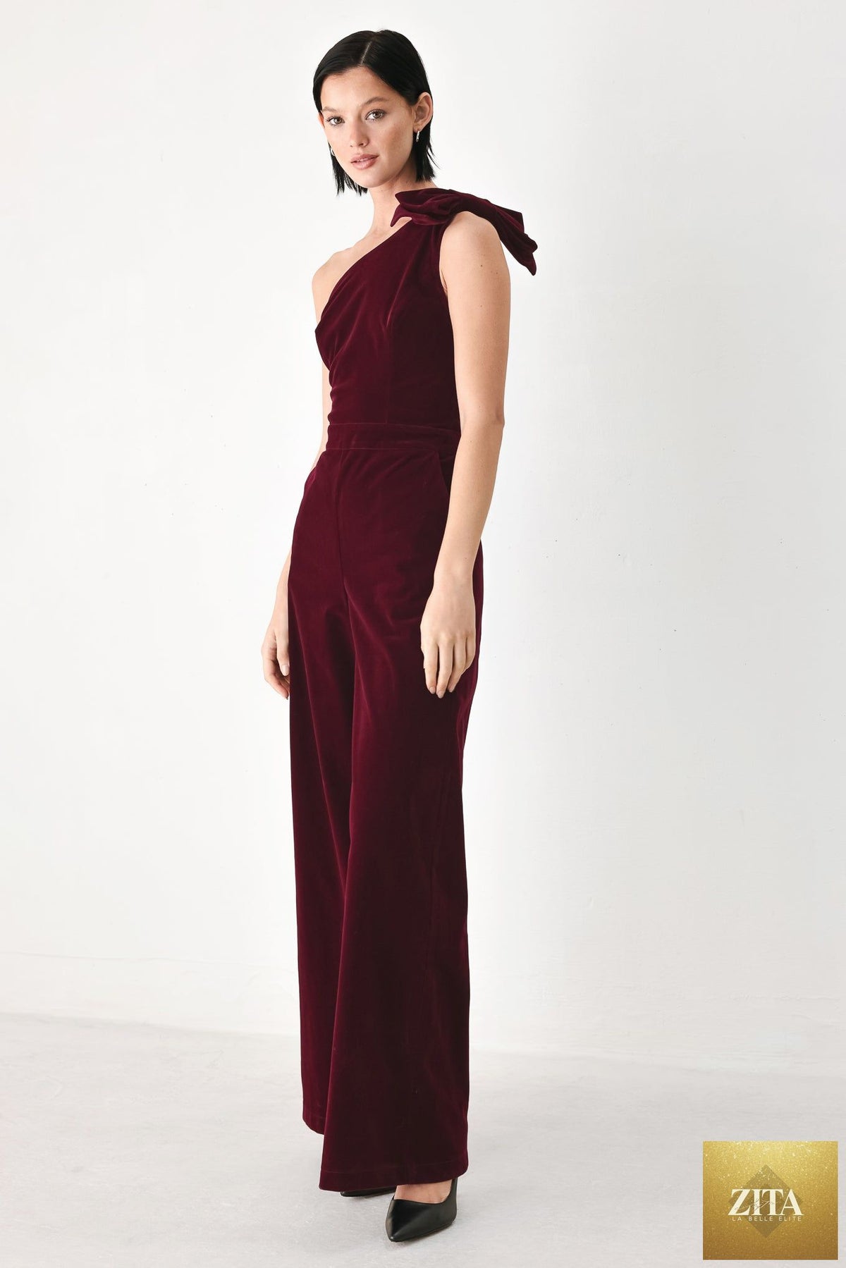 BERRY AFTER DARK VELVET BOW ONE-SHOULDER JUMPSUIT