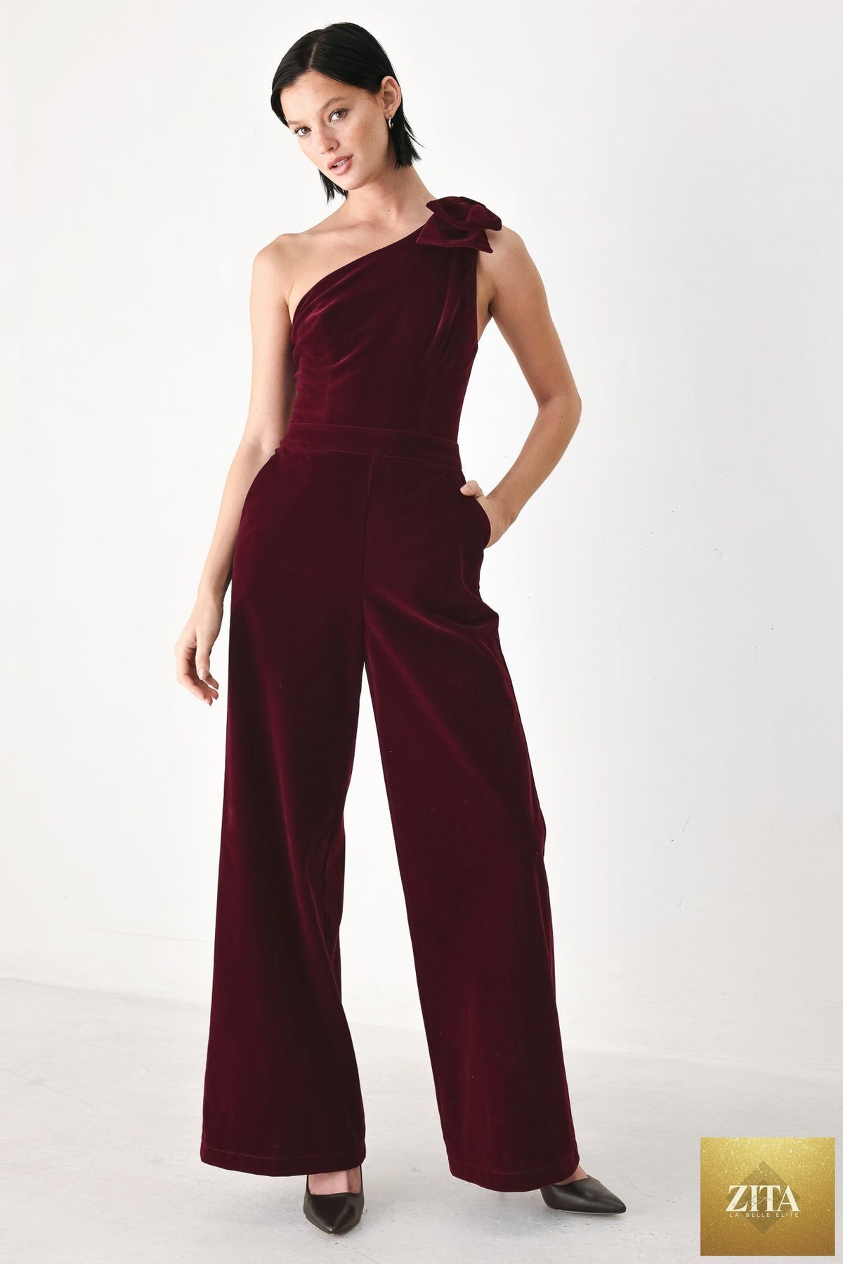 BERRY AFTER DARK VELVET BOW ONE-SHOULDER JUMPSUIT