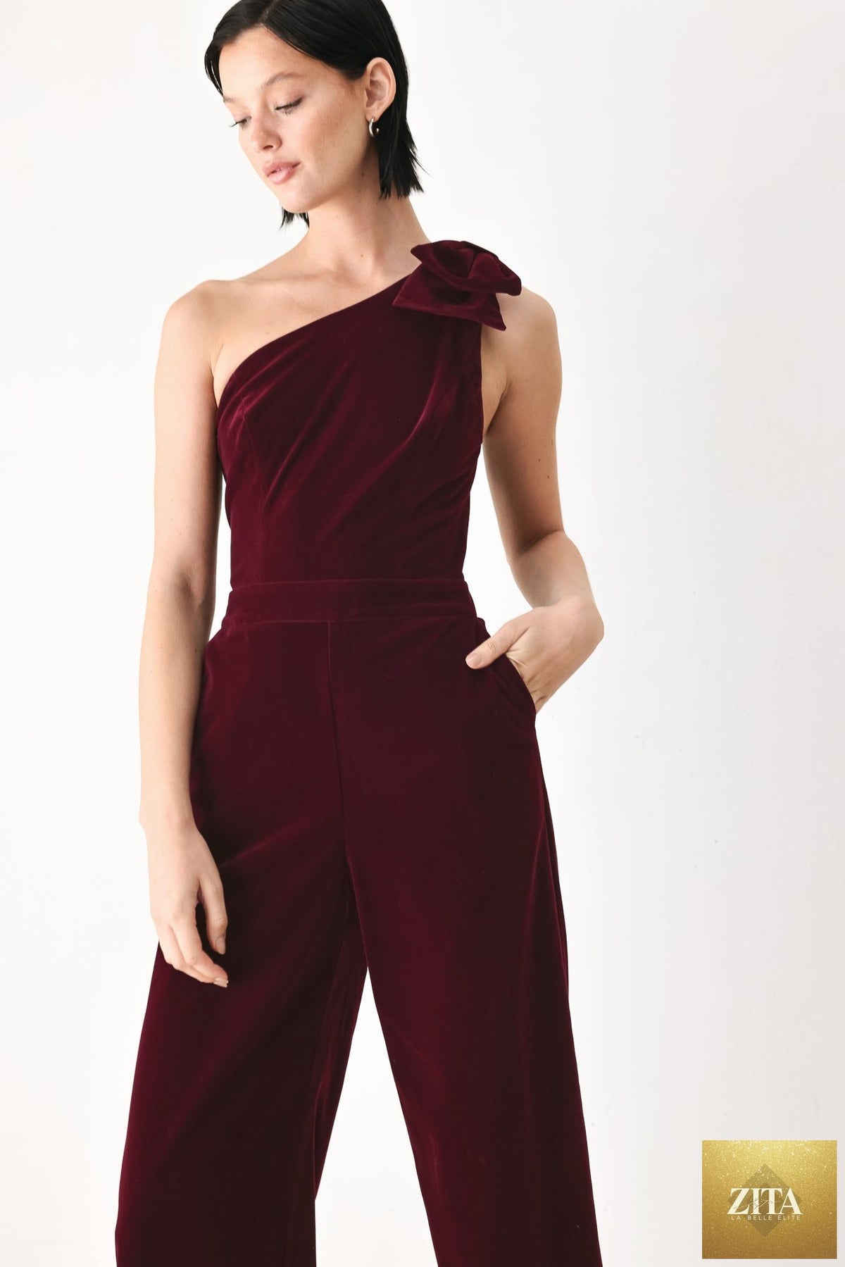 BERRY AFTER DARK VELVET BOW ONE-SHOULDER JUMPSUIT