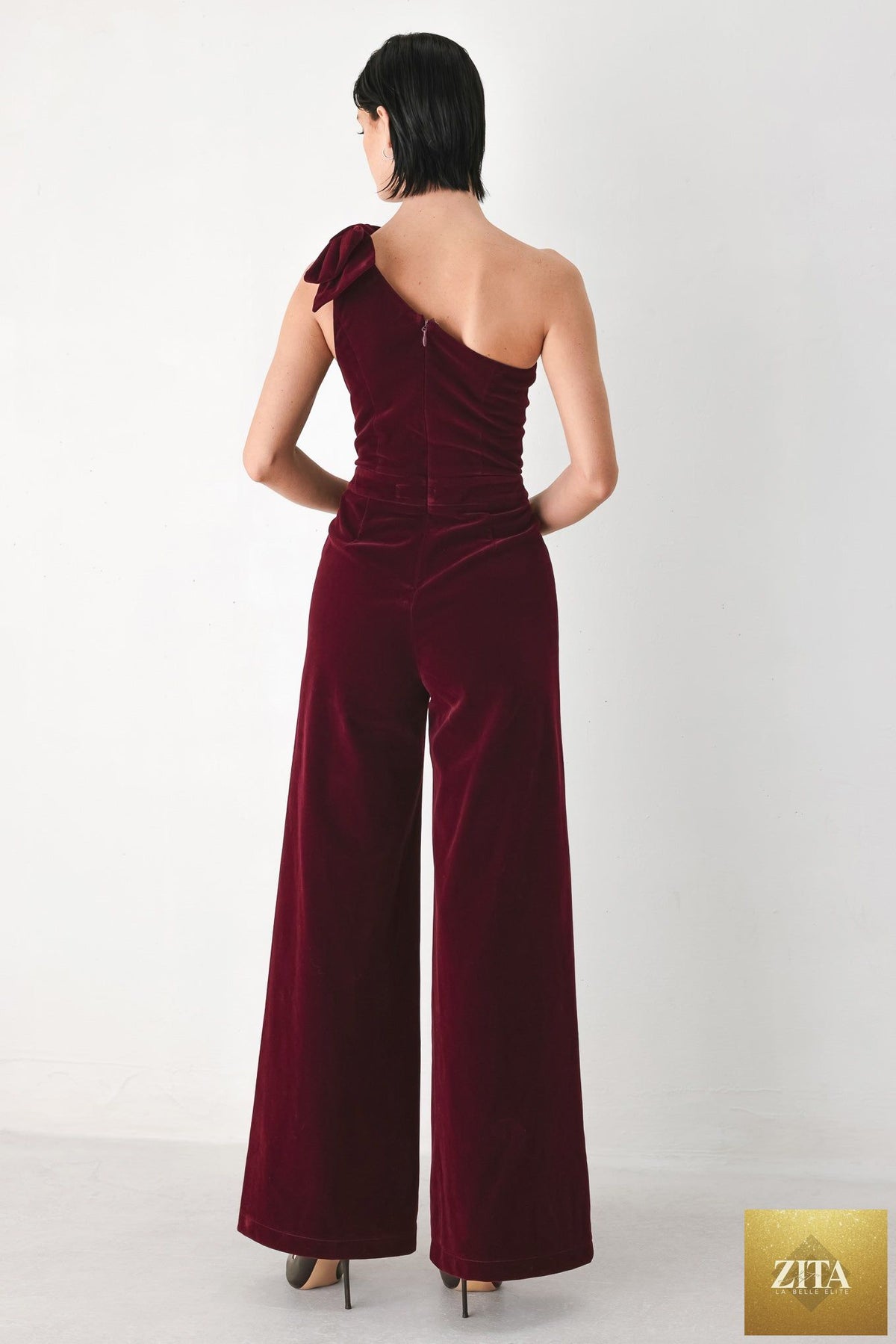 BERRY AFTER DARK VELVET BOW ONE-SHOULDER JUMPSUIT