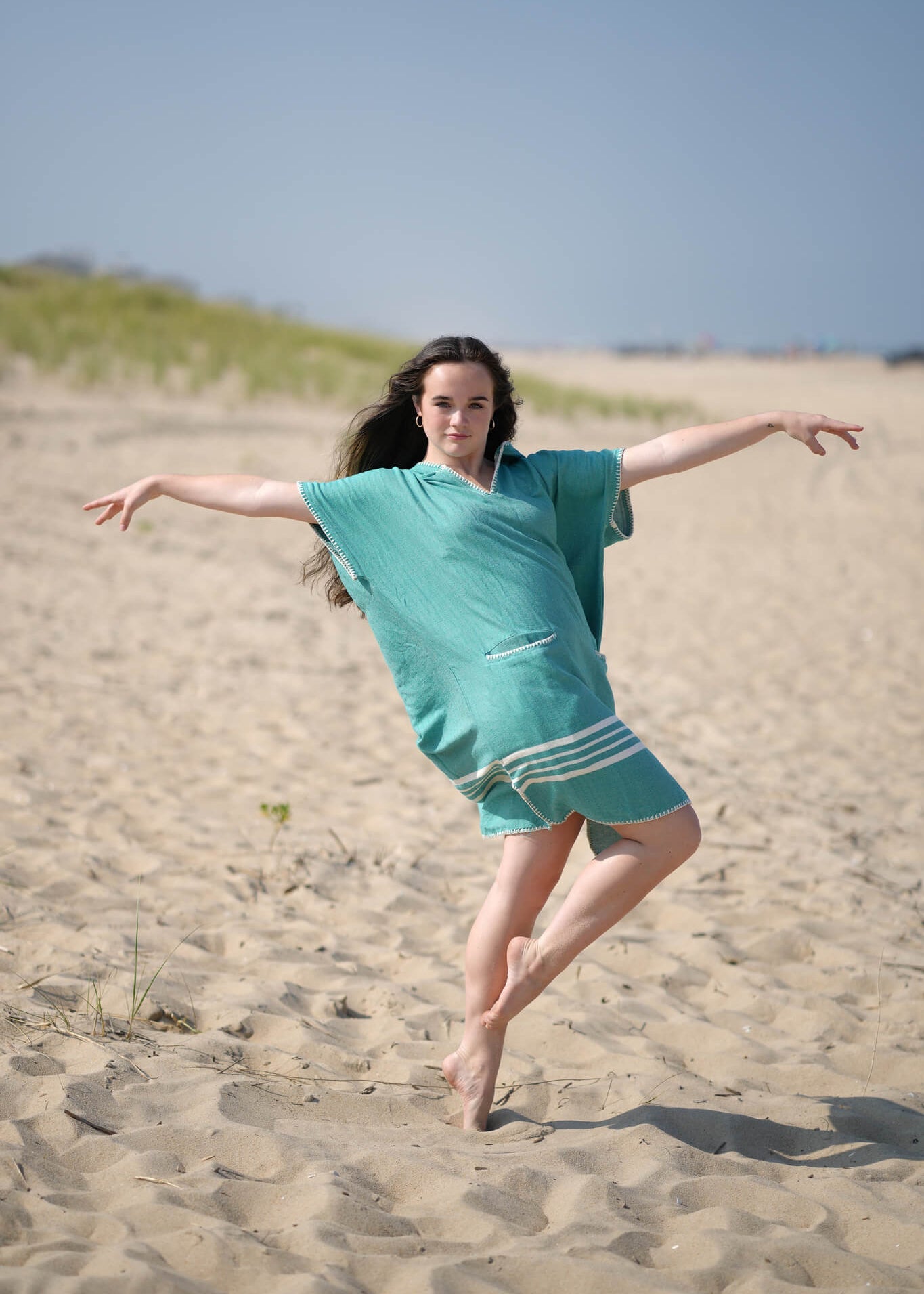 Green Buldano beach cover-up poncho with hood, lightweight and casual for seaside wear.