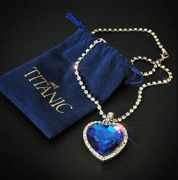 Titanic Heart of Ocean blue pendant necklace by FLIPSTYLEZLLC with velvet bag, featuring a heart-shaped love design.