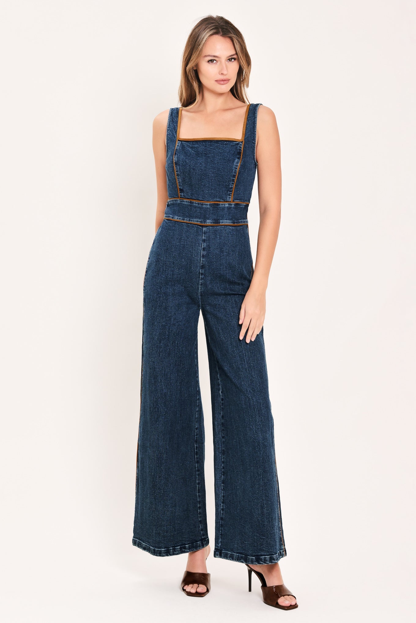 Flying Tomato Western Star Daydream denim jumpsuit in medium indigo, featuring long sleeves and a relaxed fit.
