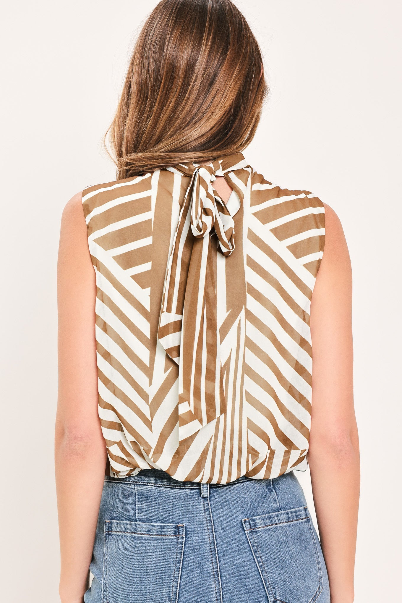 Flying Tomato Latte Ribbon Rhapsody woven top in mocha, featuring a stylish, textured fabric with a relaxed fit and feminine design.