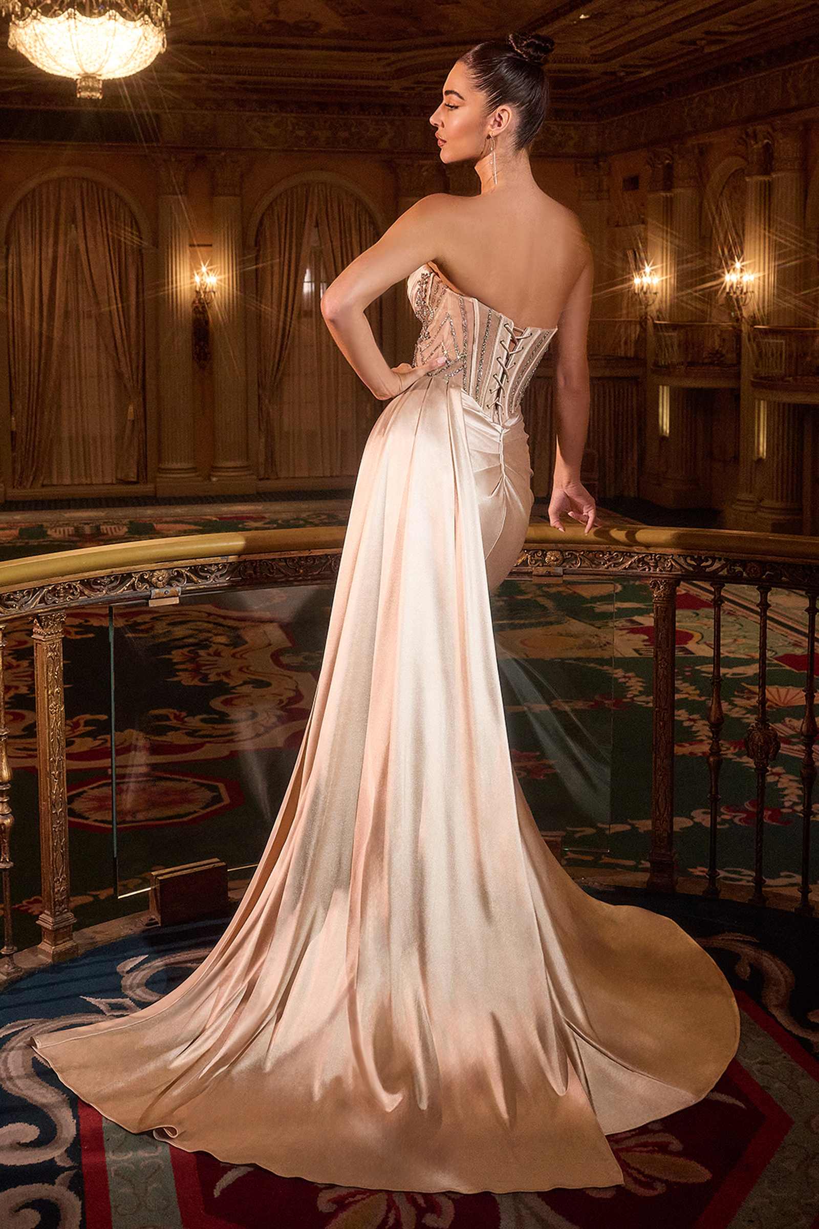 Champagne gold Ladivine strapless satin fitted gown with side sash, shown from the back. Elegant formal dress for special occasions.