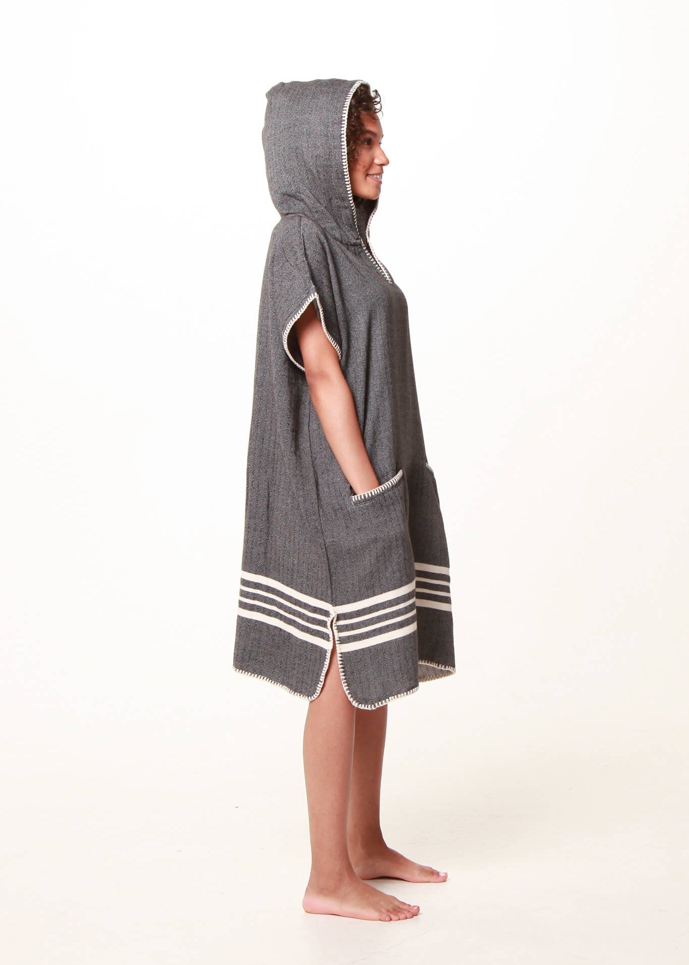 Black Buldano beach cover-up poncho with hood, lightweight and comfortable for seaside wear.