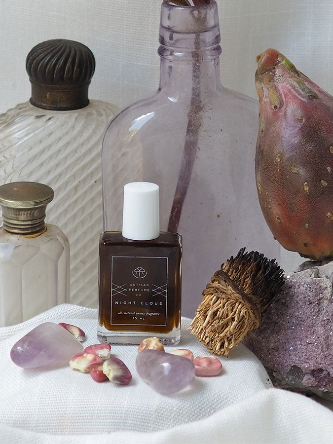 Night Cloud perfume bottle by Smoke Perfume with a sleek glass design and cloud-themed packaging, displayed on a neutral background.