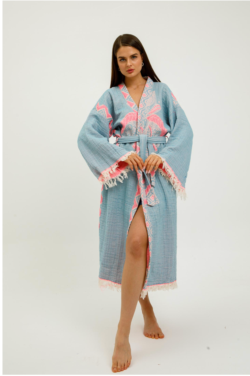 Pink jungle-themed kimono by Buldano featuring elephant patterns, shown draped on a hanger.