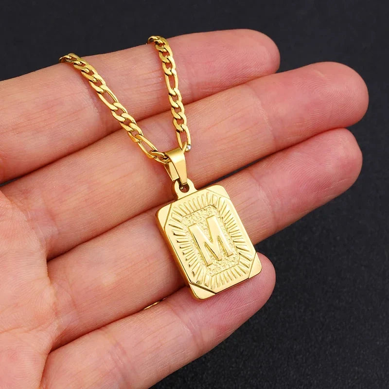Simple stainless steel initial pendant necklace with Cuba link chain for women and men, ideal for couples and everyday wear.