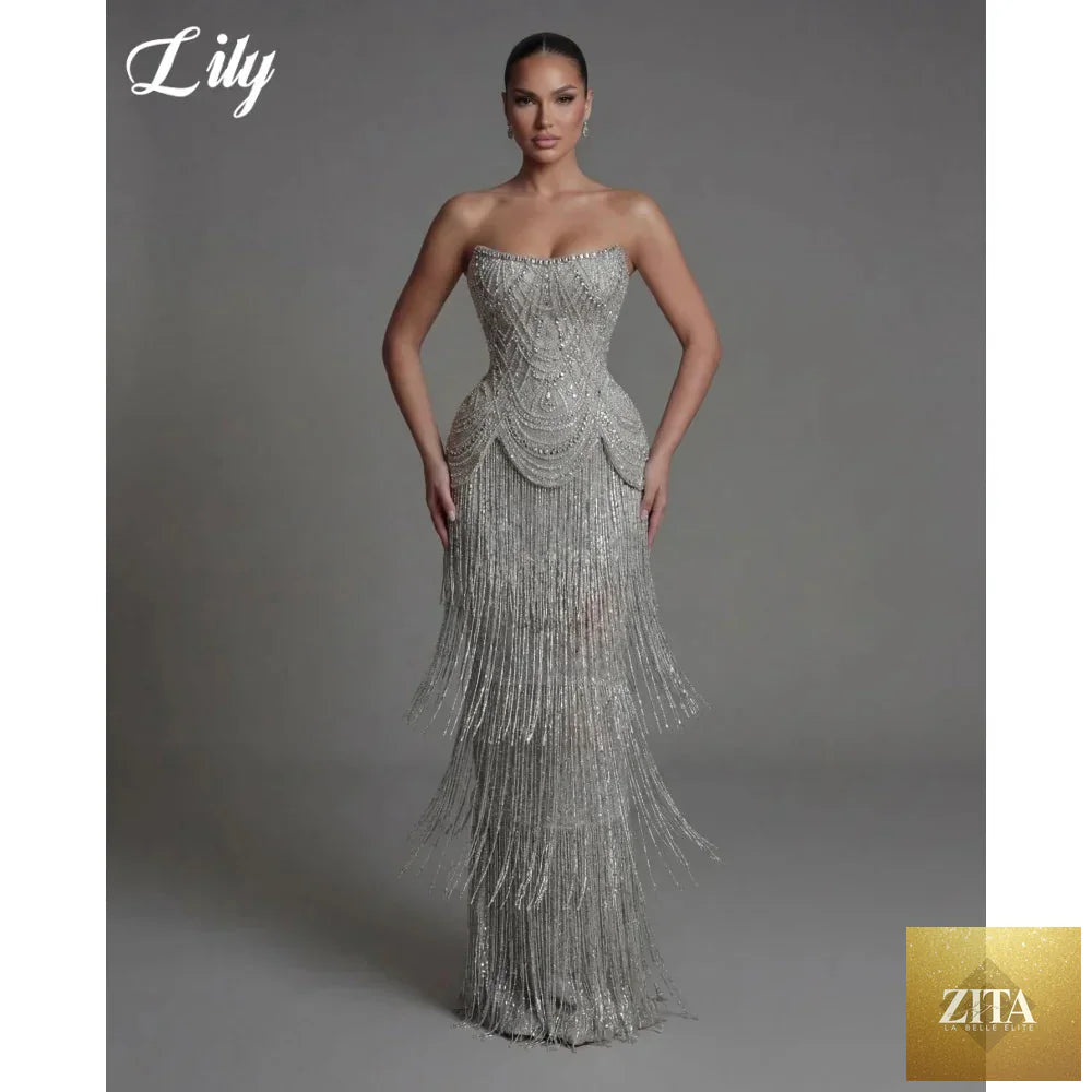 Silver strapless prom dress with beaded corset and fringe skirt, designed by FLIPSTYLEZLLC, perfect for evening and party occasions.