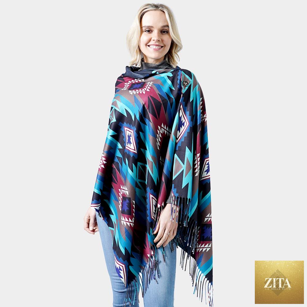 Black Madeline Love Western double-sided shawl or poncho with fringed edges, draped over a neutral background.