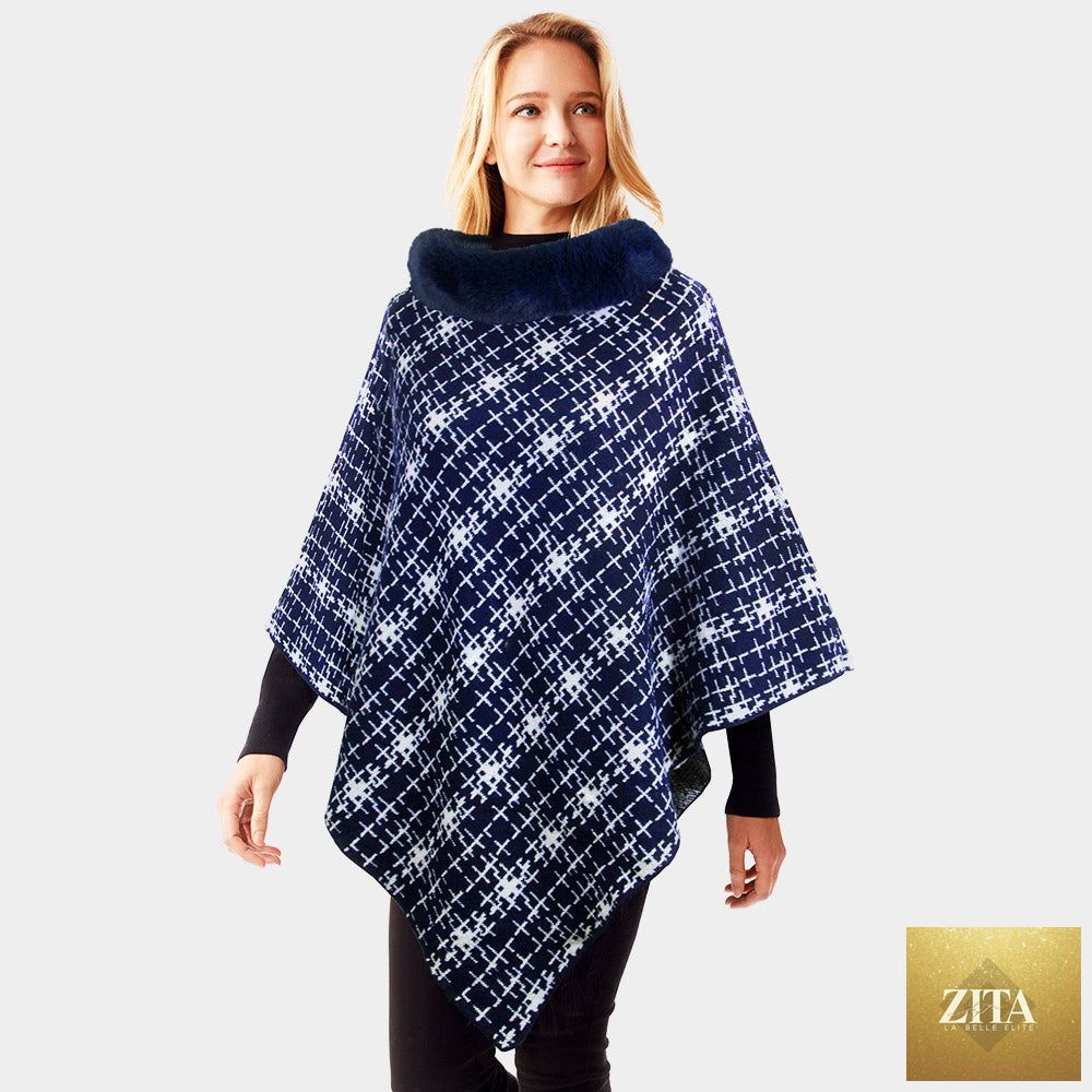 Navy patterned faux fur collar poncho from Madeline Love with a cozy, stylish design and fringed edges.