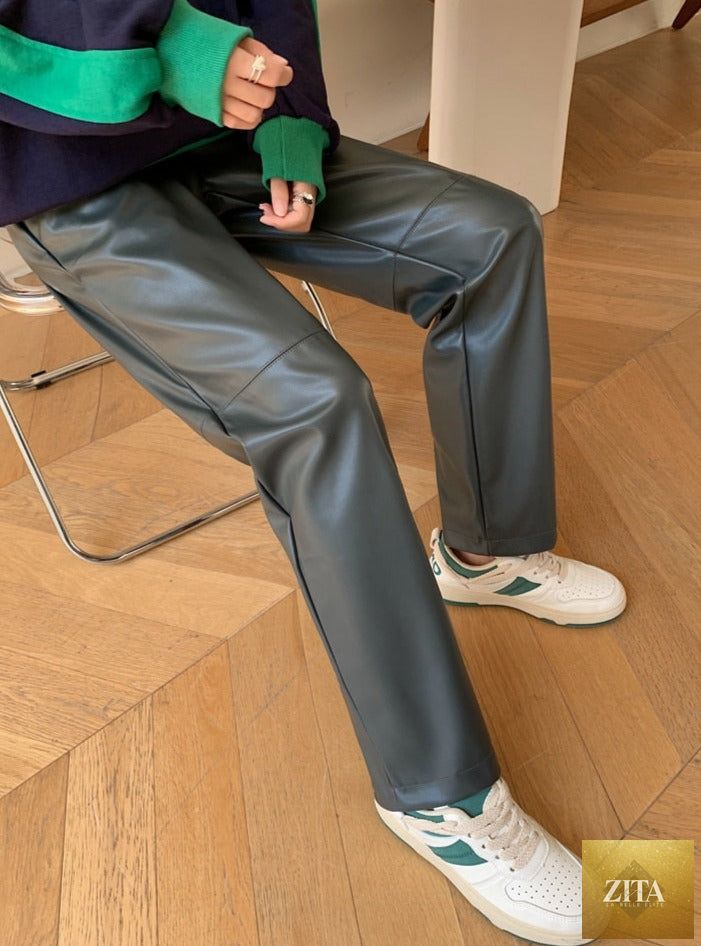Drawstring PU leather trousers for women with elastic waist and straight fit, featuring faux leather material and stylish design.