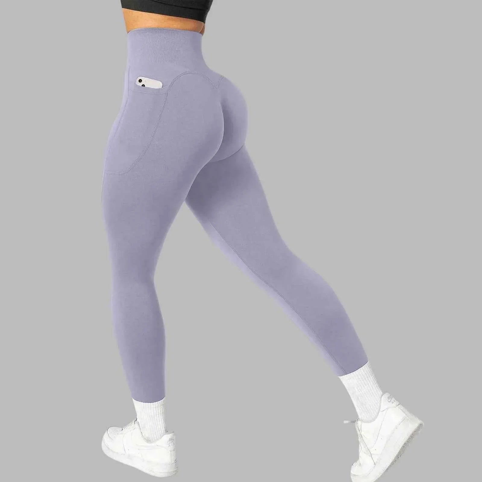 Women's seamless pocket yoga leggings by THRIXINE, showing the comfortable fit and side pocket design in a neutral color.