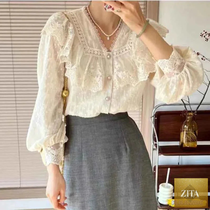 White elegant blouse with ruffled sleeves and long sleeves for women, suitable for office wear by Corporación Turística.