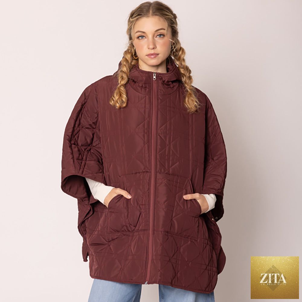 Madeline Love puffer cape poncho in burlywood color, cozy and stylish outerwear with quilted design and hood.