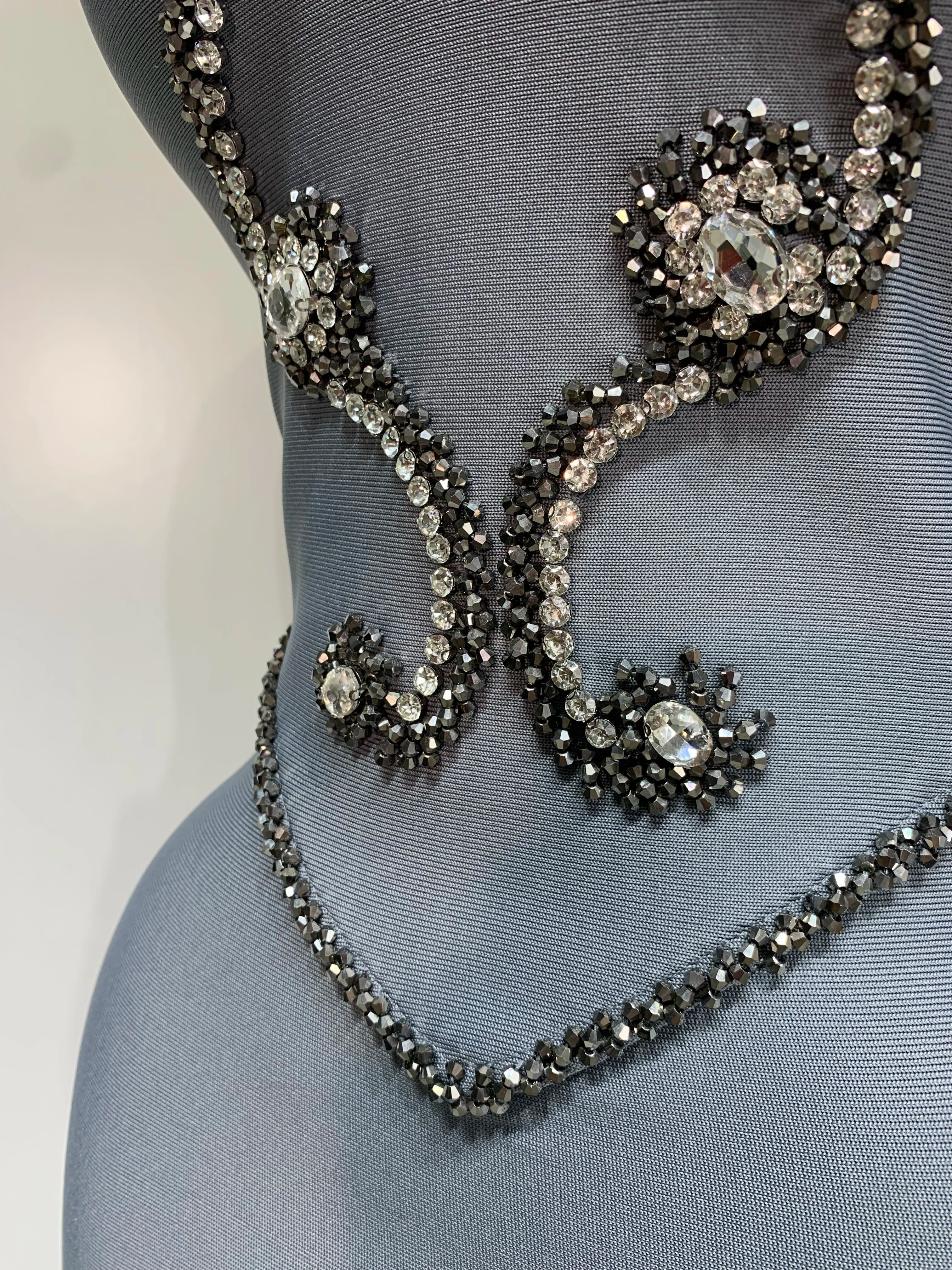 Elegant strapless beaded bandage dress by FLIPSTYLEZLLC featuring a necklace detail, perfect for evening parties and special occasions.