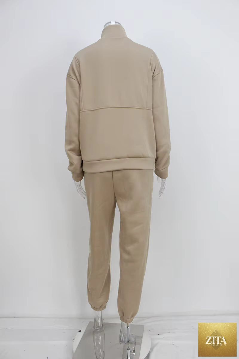 Women's full-zip cropped sweatshirt and wide-leg fleece pants two-piece set by MERIDGE, shown in soft, cozy fabric.