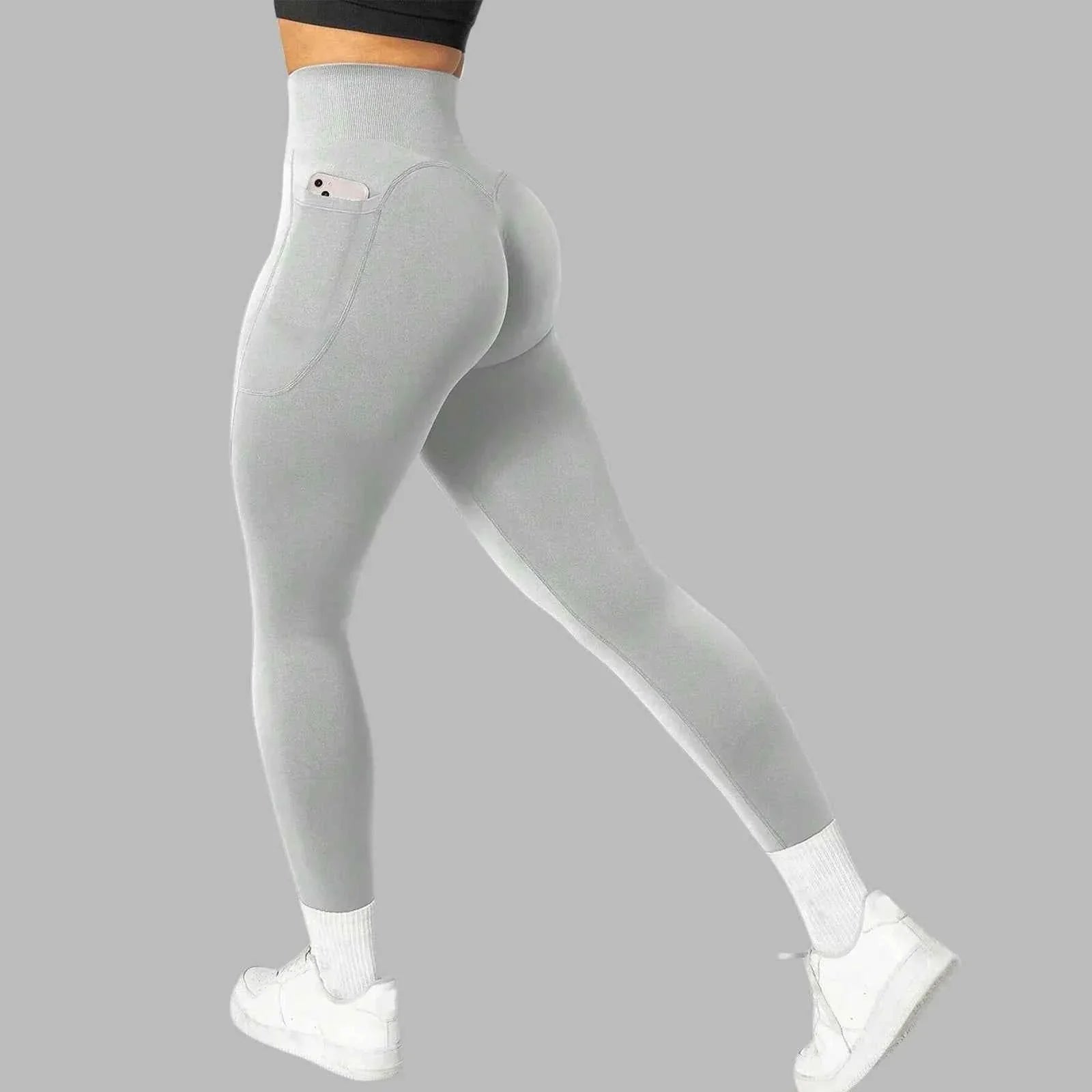Women's seamless pocket yoga leggings by THRIXINE, featuring a snug fit and functional side pockets for activewear comfort.