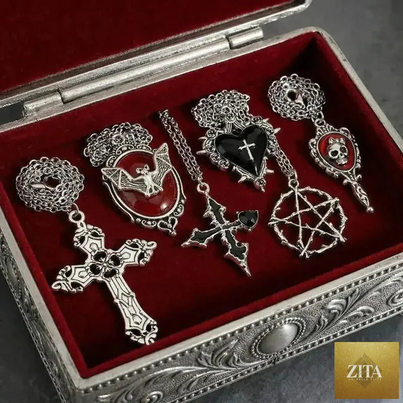 Five-piece gothic necklace set for women featuring heart, bat, spider, and cross pendants on sweater chains, trendy Halloween jewelry.